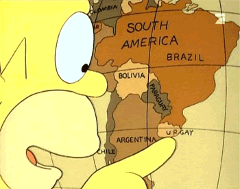 Homer Simpson pointing to Uruguay on a map.