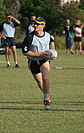 Hughie running with the football.